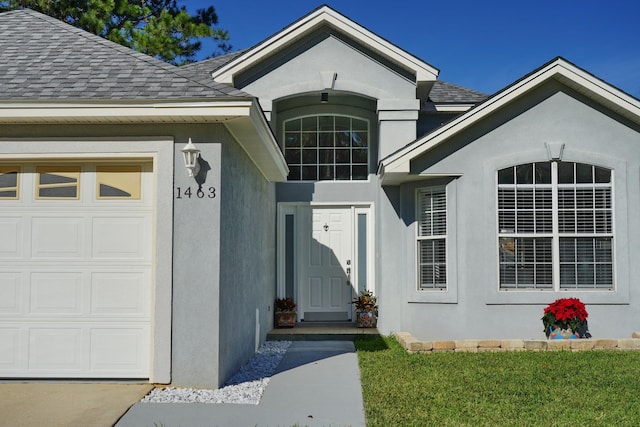 entrance to property featuring a garage