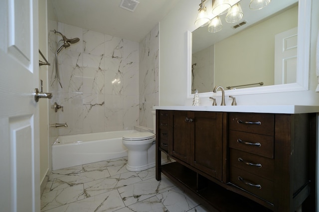 full bathroom featuring toilet, vanity, and tiled shower / bath