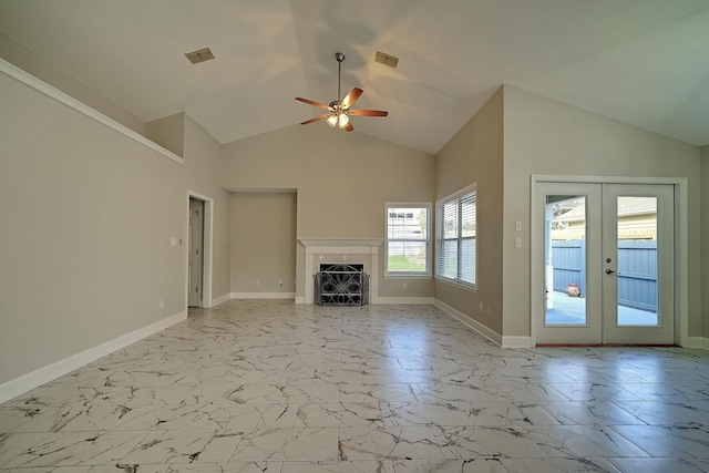 unfurnished living room featuring a fireplace, ceiling fan, french doors, and high vaulted ceiling