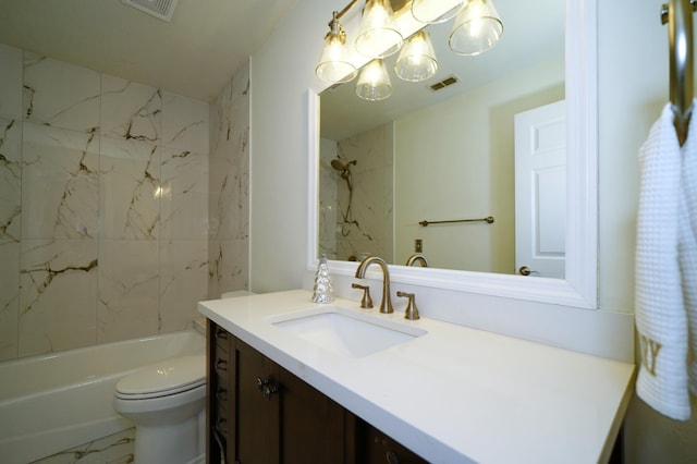 full bathroom featuring vanity, toilet, and tiled shower / bath