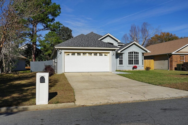 ranch-style house with a garage and a front lawn