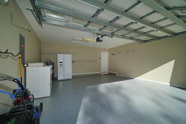 garage featuring white fridge with ice dispenser, a garage door opener, and washing machine and clothes dryer