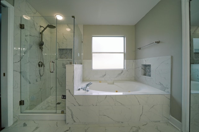 bathroom with shower with separate bathtub