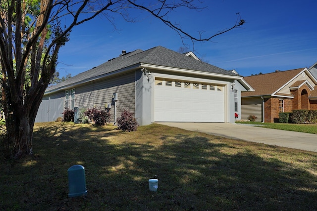 view of property exterior with a lawn and a garage