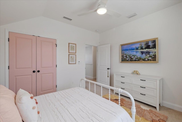 bedroom with visible vents, light carpet, ceiling fan, and vaulted ceiling
