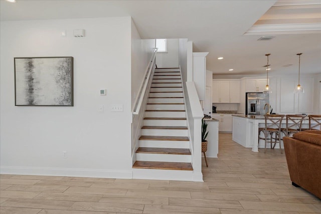 stairs with baseboards, recessed lighting, visible vents, and wood tiled floor
