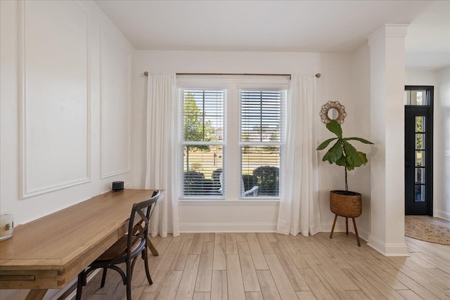 office area featuring light wood-style flooring and baseboards
