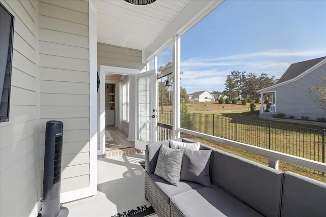 sunroom / solarium featuring heating unit