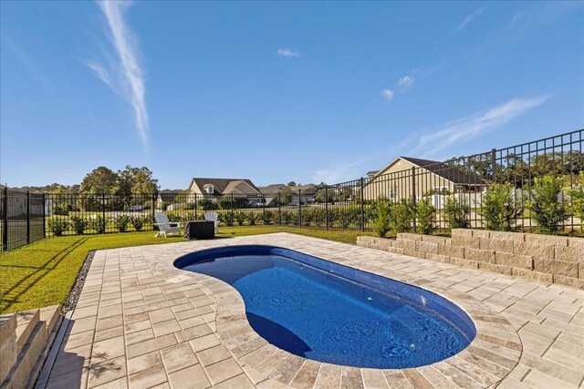 view of pool featuring a fenced in pool, fence, and a patio area