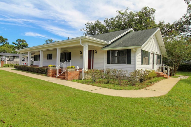 ranch-style house featuring a front lawn and a porch