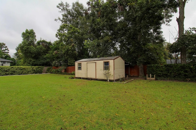 view of outbuilding featuring a yard