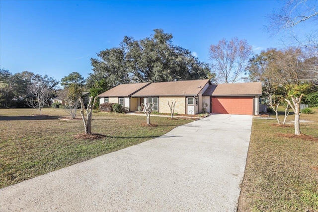 single story home featuring a garage and a front yard