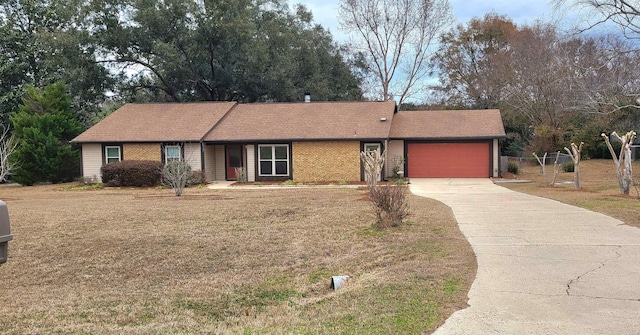 single story home featuring a garage and a front lawn