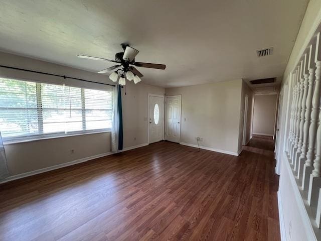 interior space featuring ceiling fan and dark hardwood / wood-style flooring