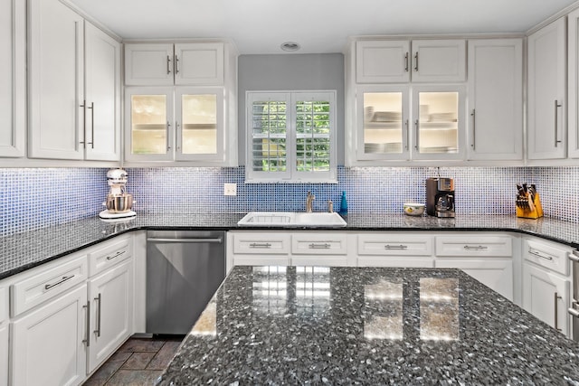 3219 Foley Dr, Tallahassee, FL 32309 - kitchen featuring dishwasher, white cabinets, decorative backsplash, and glass insert cabinets