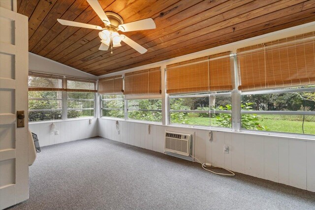 unfurnished sunroom with wood ceiling, ceiling fan, a healthy amount of sunlight, and vaulted ceiling