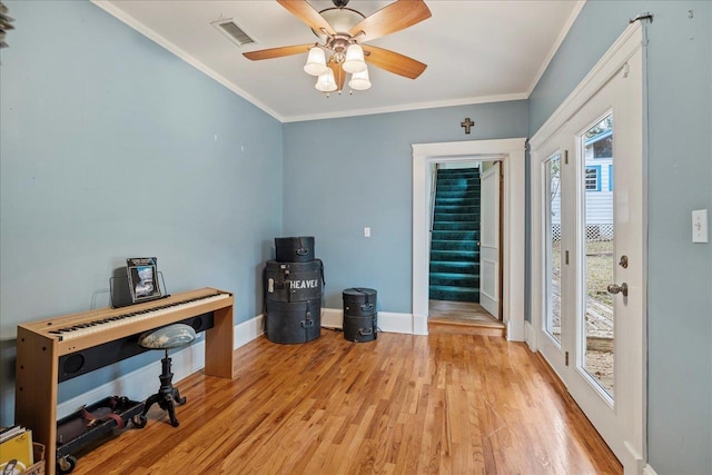 office featuring crown molding, ceiling fan, and light hardwood / wood-style flooring