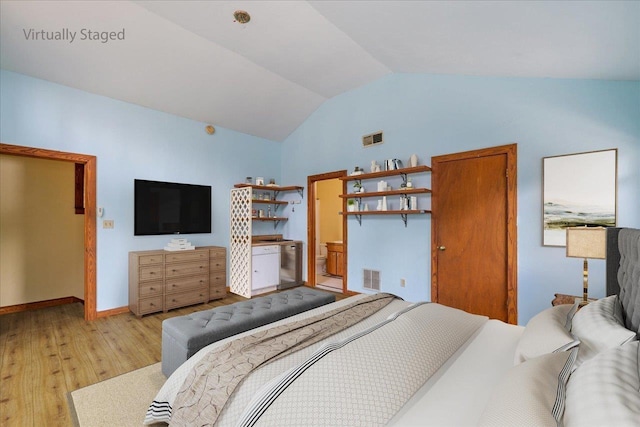 bedroom with light hardwood / wood-style flooring and vaulted ceiling