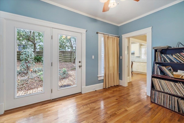 doorway to outside featuring ornamental molding, ceiling fan, and light hardwood / wood-style flooring