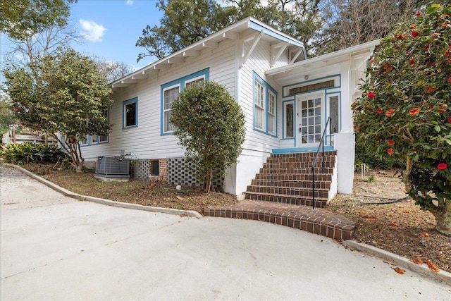 view of side of home featuring cooling unit