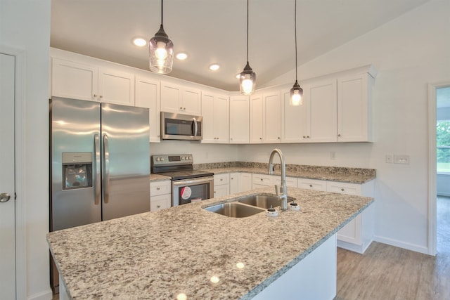 2017 Pemberton Ct, Tallahassee, FL 32309 - kitchen with white cabinetry, sink, hanging light fixtures, stainless steel appliances, and lofted ceiling
