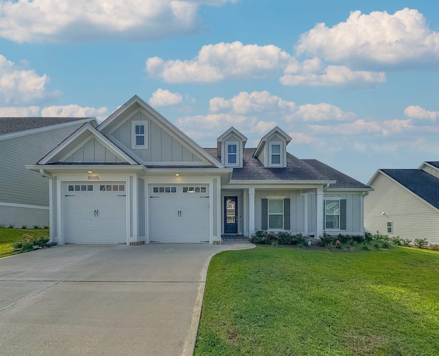 view of front of house with a garage and a front yard