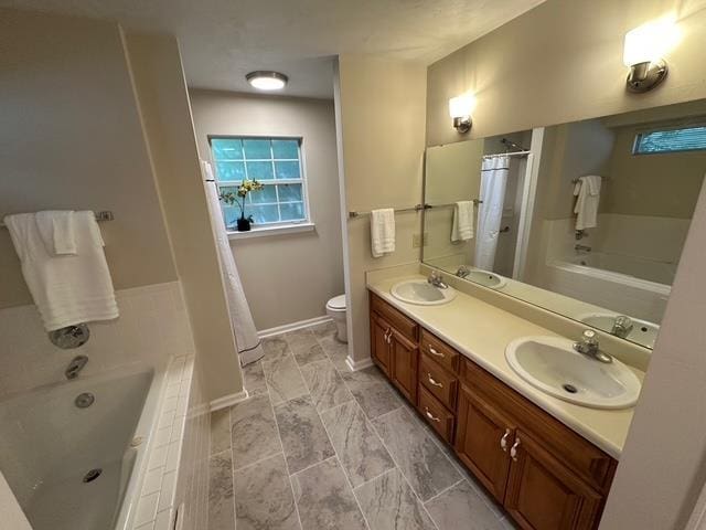 5356 Tewkesbury Trce, Tallahassee, FL 32309 - full bath with a bath, double vanity, toilet, curtained shower, and baseboards