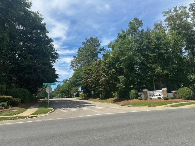 5356 Tewkesbury Trce, Tallahassee, FL 32309 - view of asphalt road with sidewalks, traffic signs, and curbs