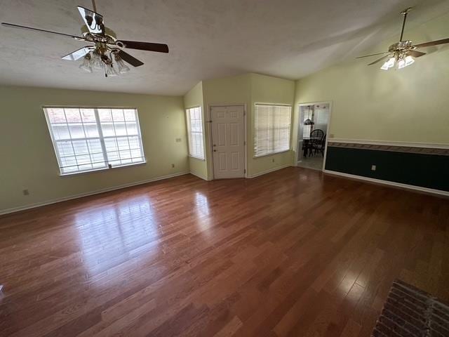 5356 Tewkesbury Trce, Tallahassee, FL 32309 - unfurnished living room with lofted ceiling, a ceiling fan, wood finished floors, and baseboards