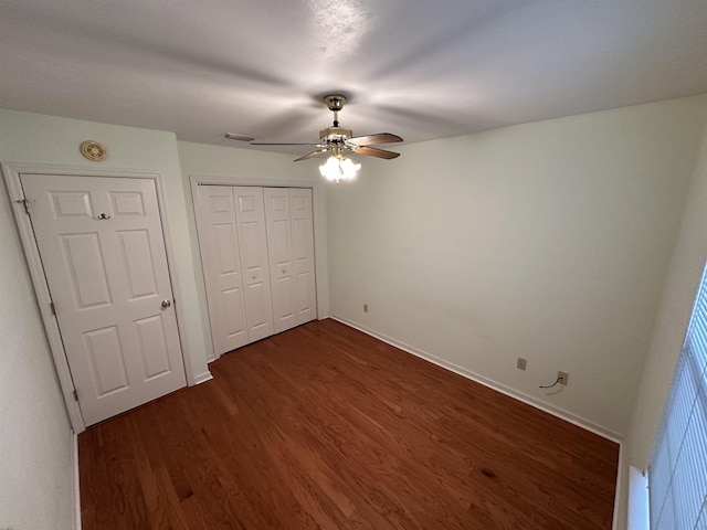 5356 Tewkesbury Trce, Tallahassee, FL 32309 - unfurnished bedroom featuring dark wood-style floors, baseboards, a closet, and ceiling fan