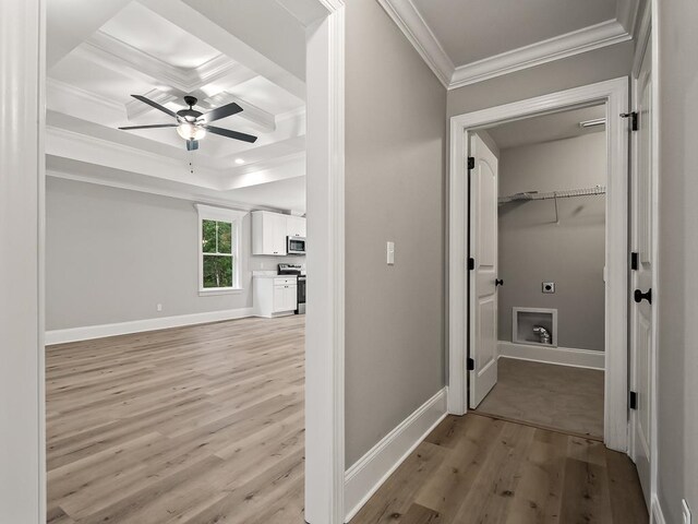 corridor with light hardwood / wood-style flooring and crown molding