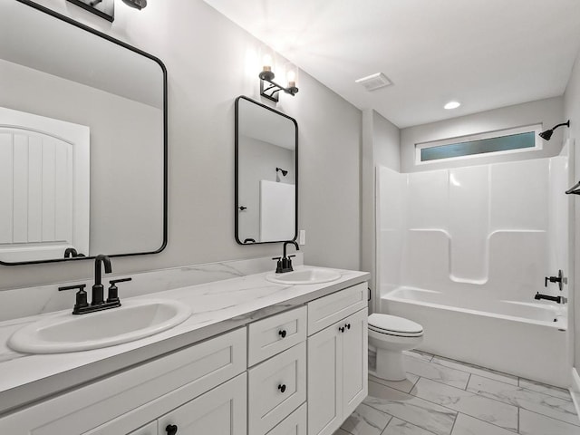 full bathroom featuring shower / tub combination, vanity, and toilet