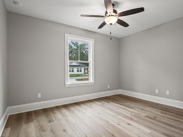 unfurnished room with ceiling fan and light wood-type flooring