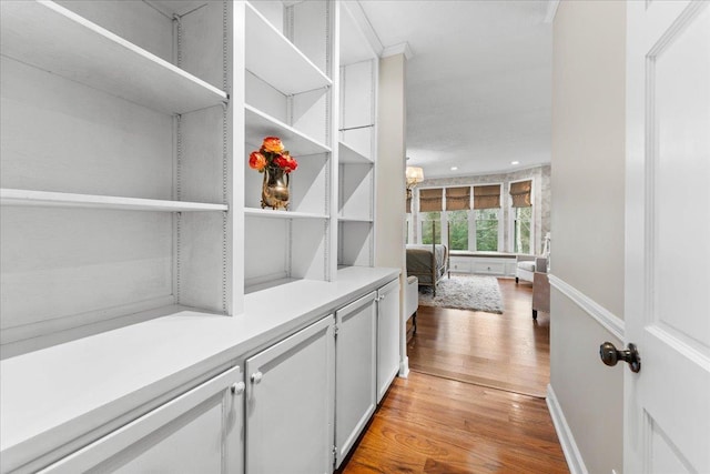 interior space featuring white cabinetry and light wood-type flooring