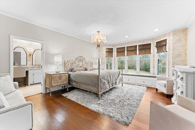 bedroom featuring crown molding, dark wood-type flooring, and an inviting chandelier