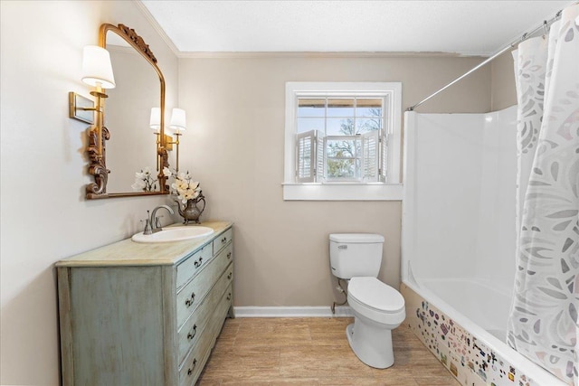 full bathroom featuring vanity, ornamental molding, shower / tub combo, and toilet