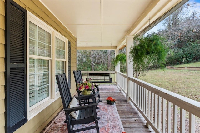 wooden terrace with a porch