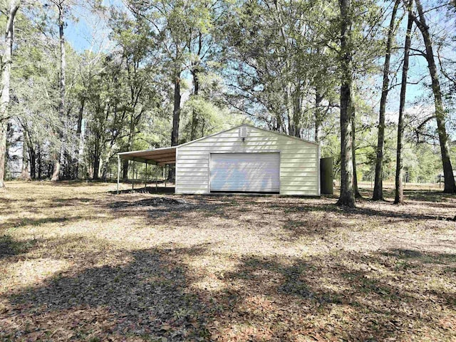 exterior space featuring an outdoor structure and driveway