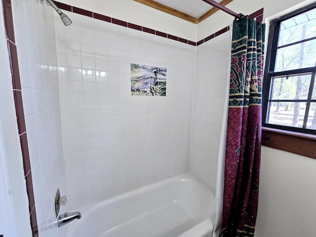 full bathroom with a healthy amount of sunlight and shower / tub combo with curtain