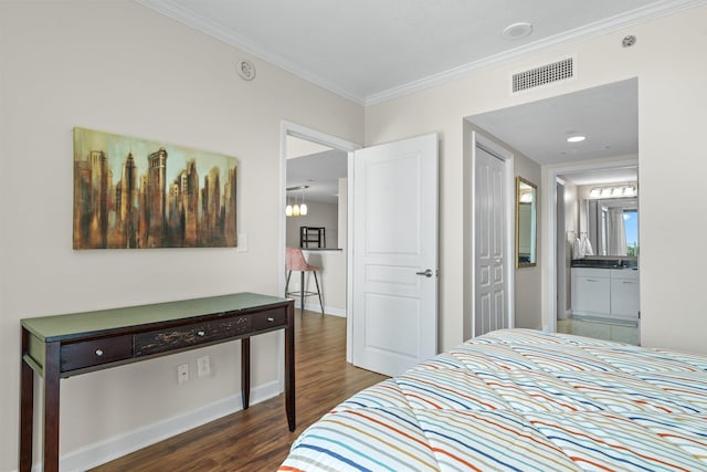 300 S Duval St Unit 503, Tallahassee, FL 32301 - bedroom with wood finished floors, crown molding, ensuite bathroom, and baseboards