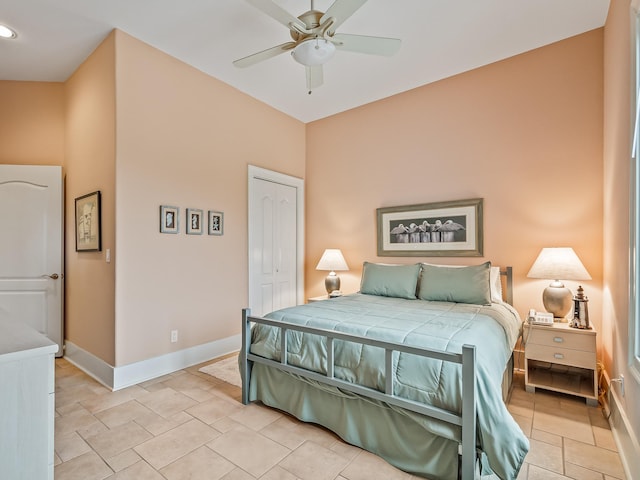 bedroom featuring ceiling fan and a closet