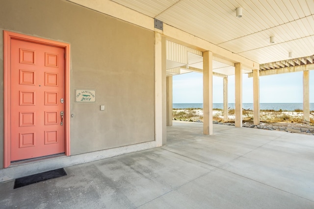 entrance to property with a water view