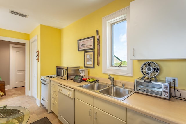 kitchen with white appliances and sink