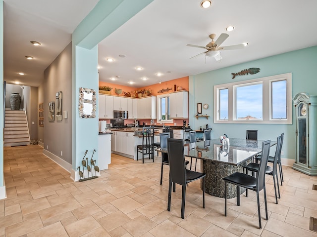 dining area with ceiling fan