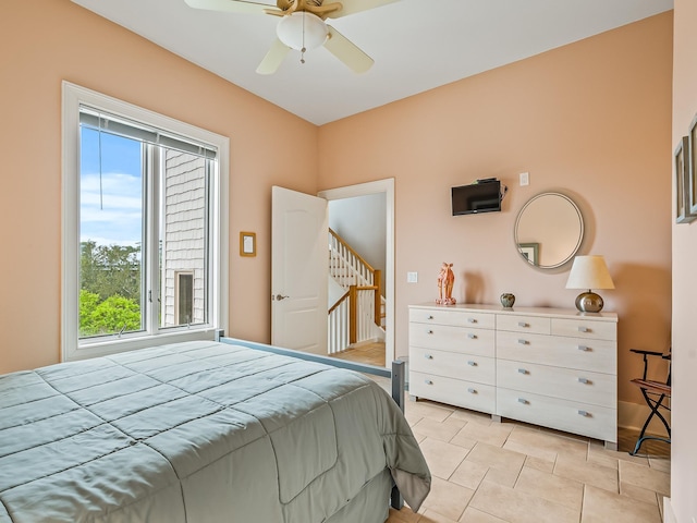 bedroom featuring ceiling fan and light tile patterned floors