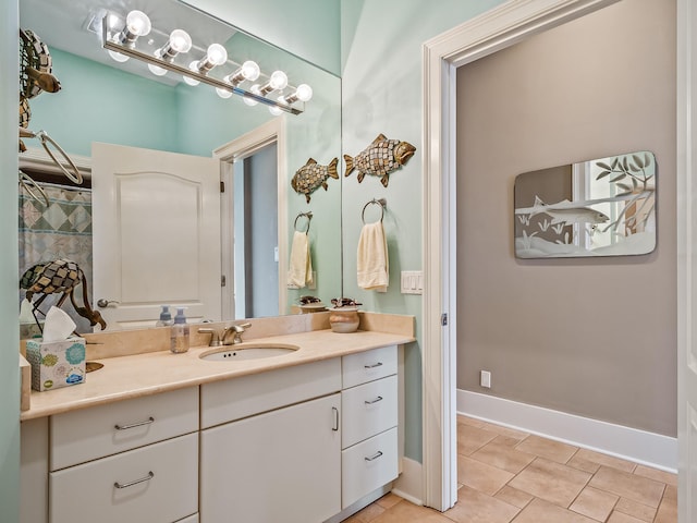 bathroom with tile patterned flooring and vanity