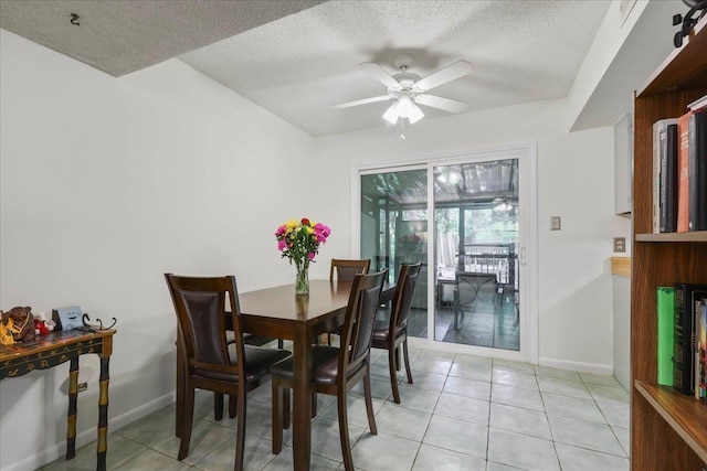 1520 Pullen Rd Unit 6, Tallahassee, FL 32303 - dining area with a ceiling fan, a textured ceiling, light tile patterned floors, and baseboards
