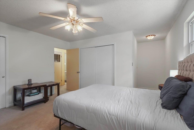 1520 Pullen Rd Unit 6, Tallahassee, FL 32303 - bedroom featuring light colored carpet, a closet, a textured ceiling, a ceiling fan, and baseboards