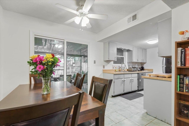 1520 Pullen Rd Unit 6, Tallahassee, FL 32303 - dining room with a ceiling fan, light tile patterned floors, and a textured ceiling