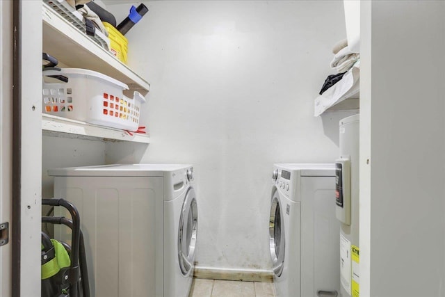 1520 Pullen Rd Unit 6, Tallahassee, FL 32303 - washroom with washer and clothes dryer and light tile patterned flooring